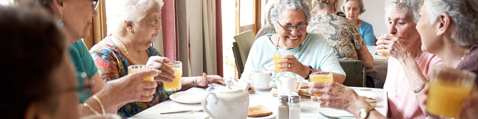 Alzheimer's patients enjoying each other in a memory care home - Browse the Alzheimer's Store - The best products dining for those with Alzheimer's, Dementia, Stroke, Memory Loss and for senior care